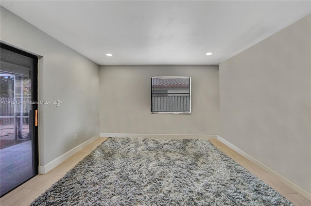 spare room featuring light hardwood / wood-style floors