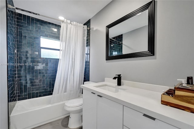 full bathroom featuring shower / bath combination with curtain, toilet, and large vanity