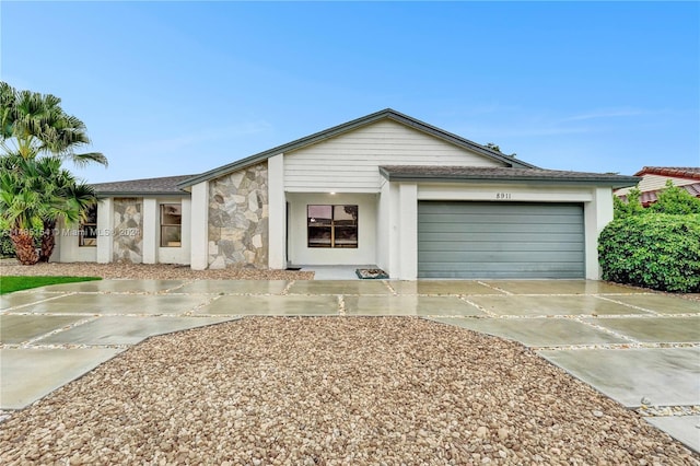 ranch-style home with a garage