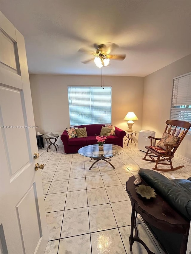 living room with ceiling fan and light tile patterned floors