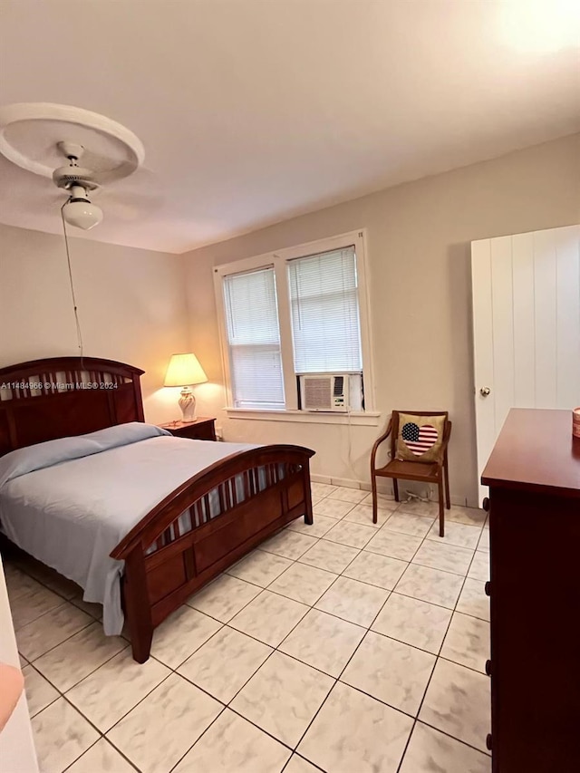 tiled bedroom with cooling unit and ceiling fan