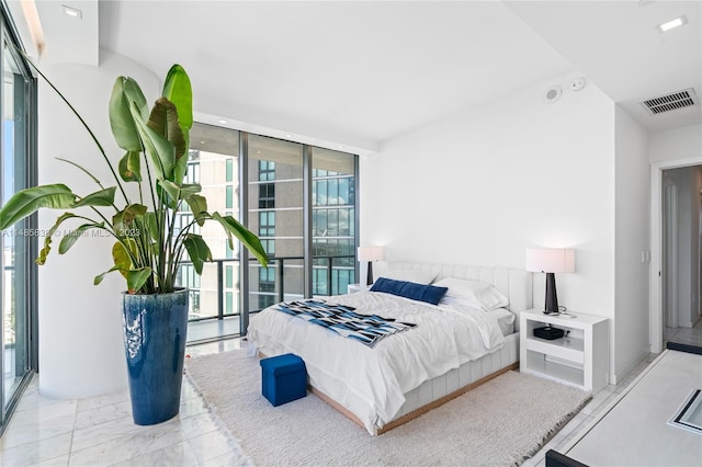 tiled bedroom with multiple windows