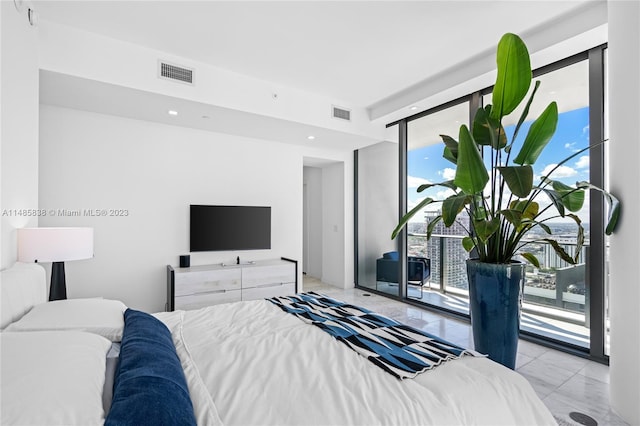 bedroom featuring light tile floors and access to outside