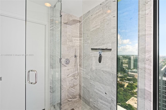 bathroom with a shower with shower door