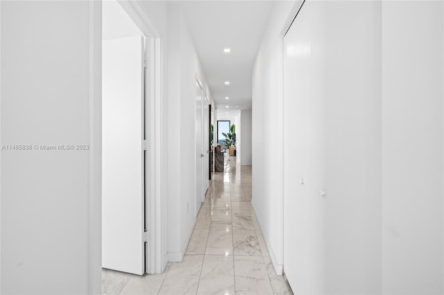 hall with light tile floors