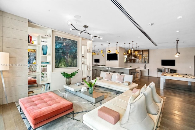 living room with hardwood / wood-style floors and pool table