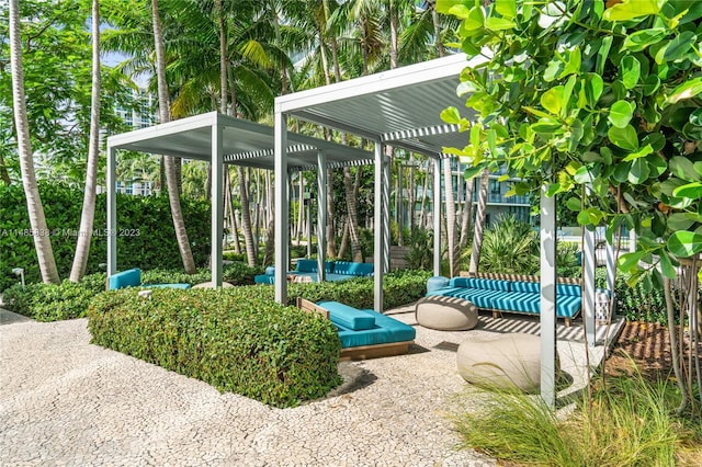 exterior space featuring an outdoor hangout area, a pergola, and a patio