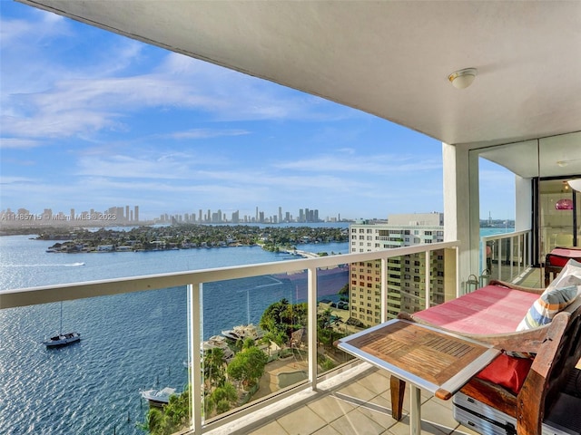 balcony featuring a water view