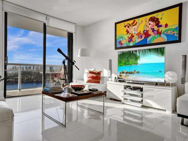 tiled living room with a water view