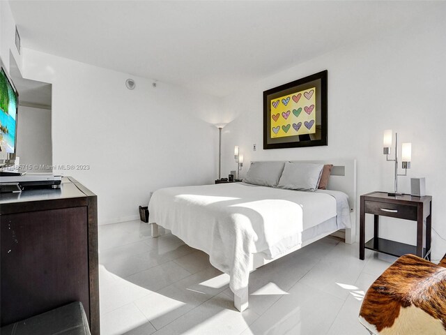 bedroom featuring light tile patterned flooring