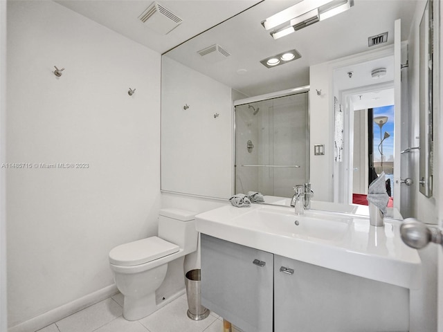 bathroom featuring vanity, toilet, and tile patterned floors