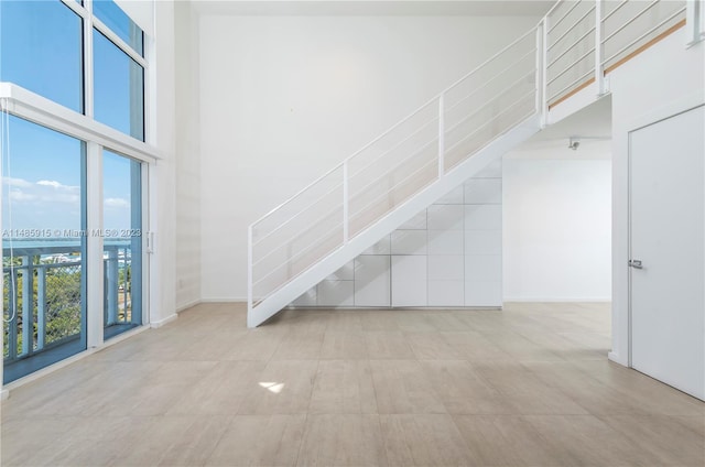 stairway with a towering ceiling