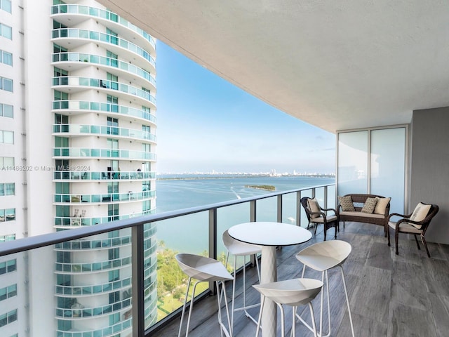 balcony featuring a water view