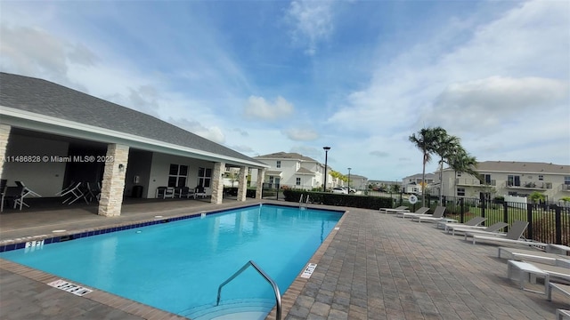 view of swimming pool with a patio area