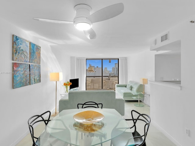 dining space featuring ceiling fan