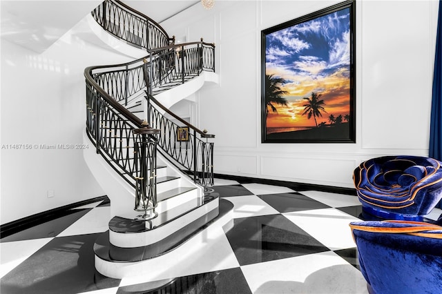 stairs featuring tile flooring