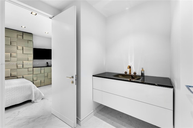 bathroom with tile floors and sink