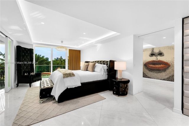 tiled bedroom with an inviting chandelier and a tray ceiling