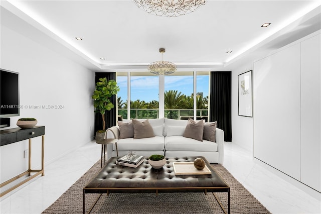 tiled living room with a tray ceiling