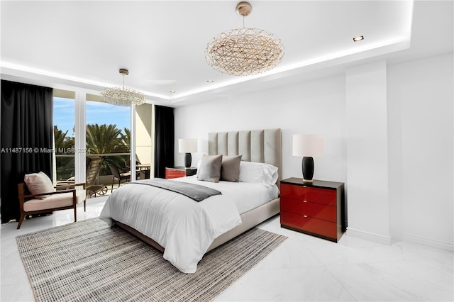 tiled bedroom featuring a raised ceiling and a notable chandelier