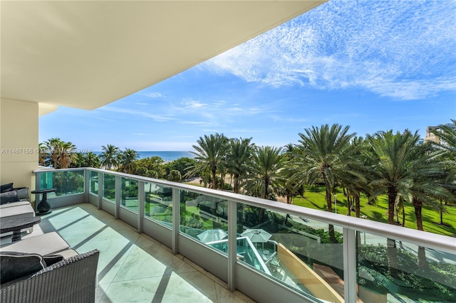 balcony featuring a water view