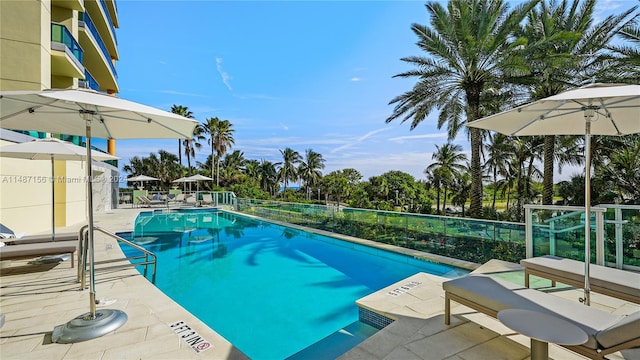 view of swimming pool with a patio