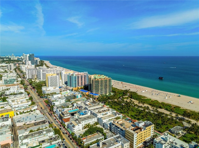 bird's eye view with a beach view and a water view