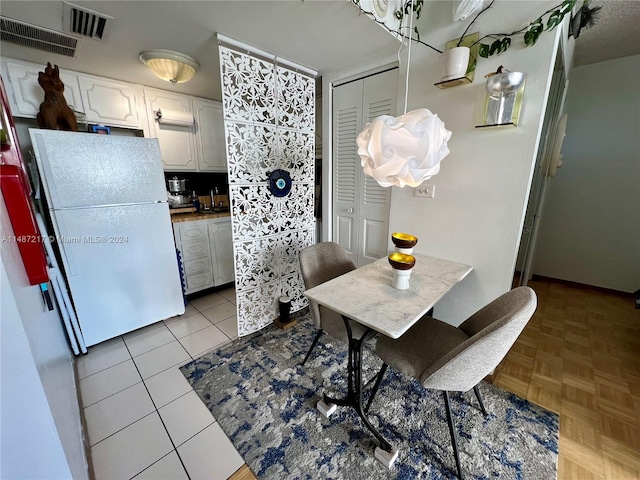 dining area with light parquet floors