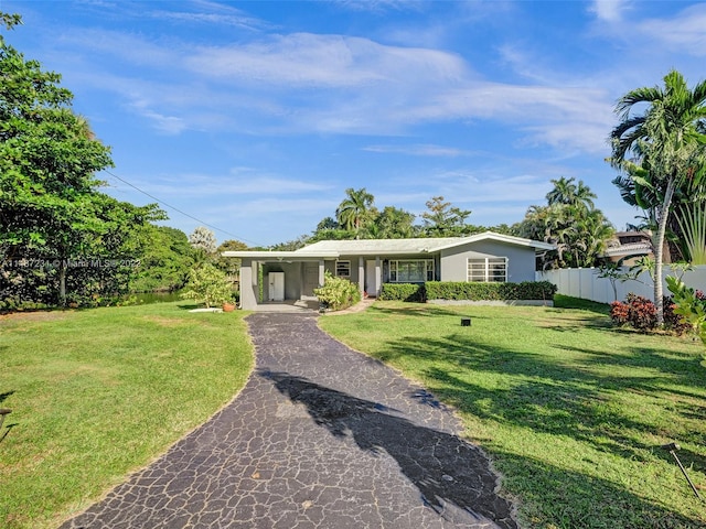 single story home with a front lawn