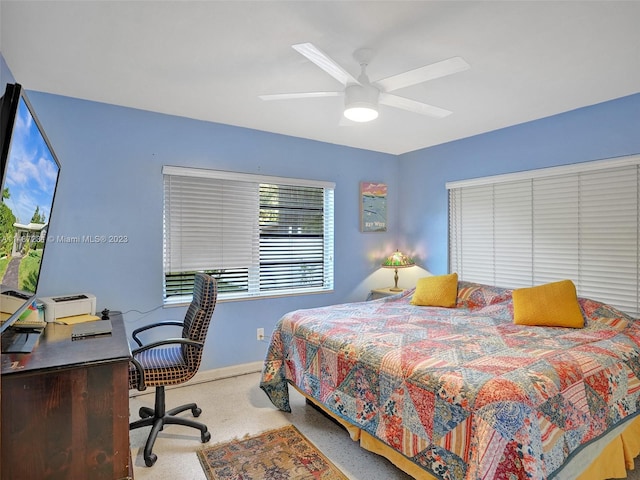 bedroom featuring ceiling fan and light colored carpet