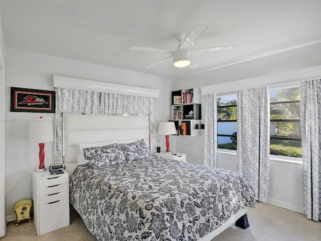 bedroom with light carpet and ceiling fan