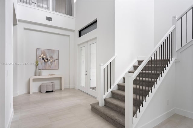 10455 SW 57th Ct, Cooper City, FL 33328 - entrance foyer with a high ceiling and light tile floors