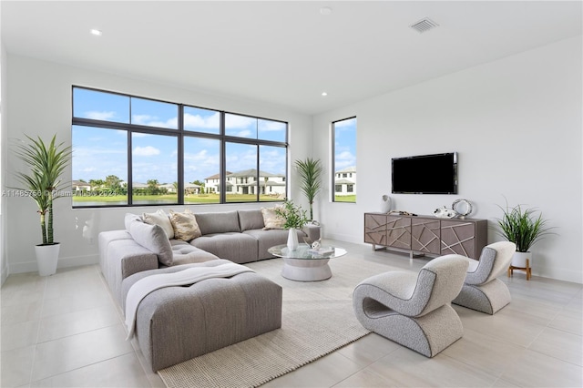 10455 SW 57th Ct, Cooper City, FL 33328 - living room featuring light tile floors and a healthy amount of sunlight