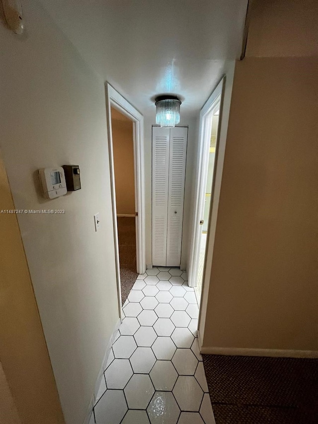 hallway with light tile floors