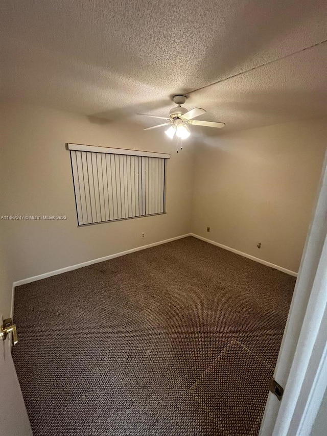 carpeted empty room featuring a textured ceiling and ceiling fan