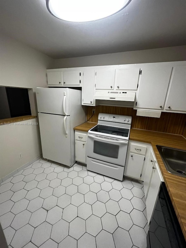 kitchen with white appliances, white cabinets, sink, and light tile flooring