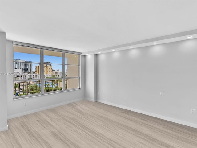 unfurnished room featuring light hardwood / wood-style floors