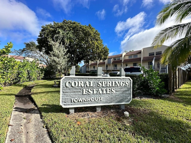 community sign with a yard