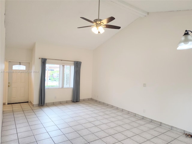 empty room with beam ceiling, ceiling fan, light tile patterned floors, and high vaulted ceiling