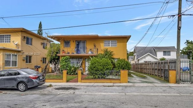 view of front of property featuring a balcony