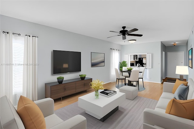 living room with ceiling fan and light wood-type flooring