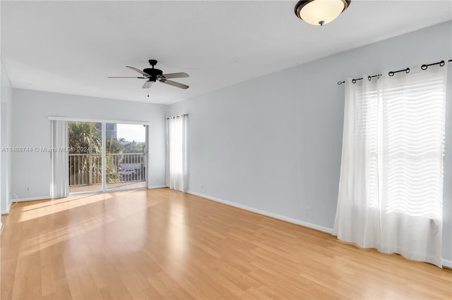 spare room featuring light hardwood / wood-style floors and ceiling fan