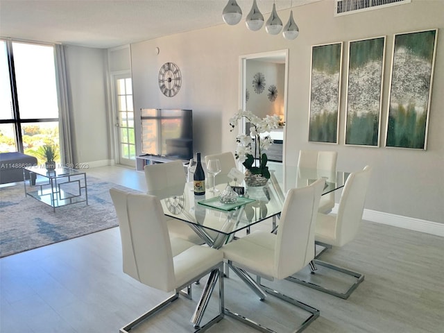 dining space featuring light hardwood / wood-style flooring