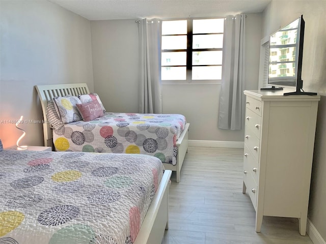 bedroom with light hardwood / wood-style flooring