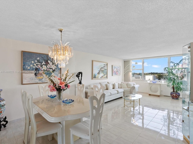 dining room featuring light tile floors, a notable chandelier, and a textured ceiling