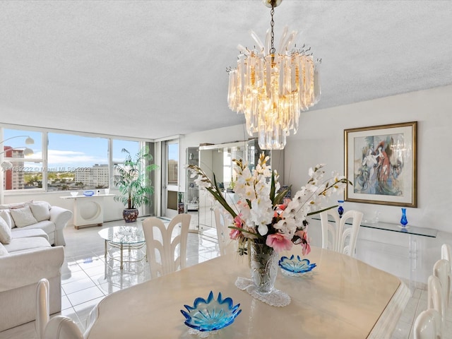 dining area featuring a textured ceiling, light tile flooring, and a chandelier