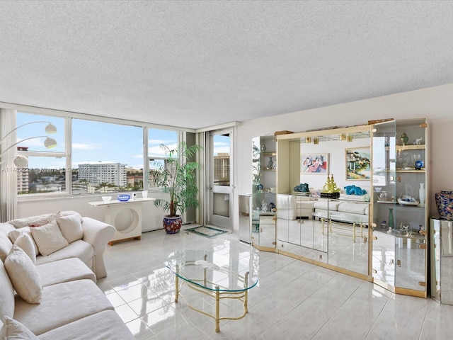 tiled living room with a textured ceiling