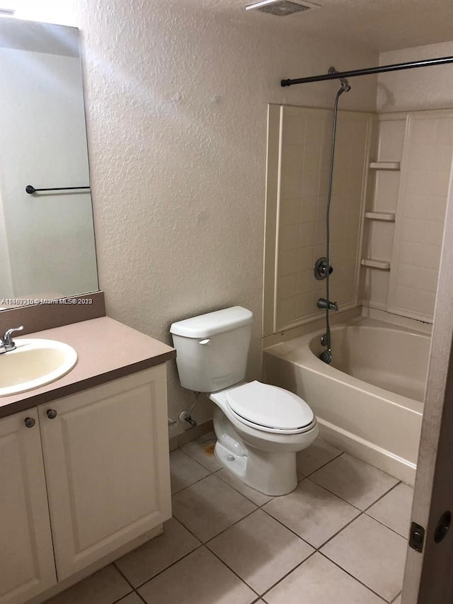 full bathroom with toilet, tile floors, vanity, and tub / shower combination