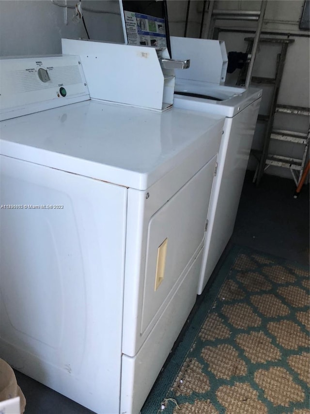 washroom with washer and clothes dryer