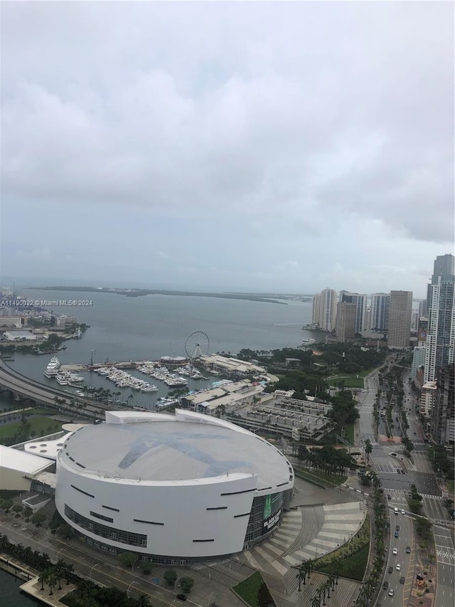 birds eye view of property with a water view